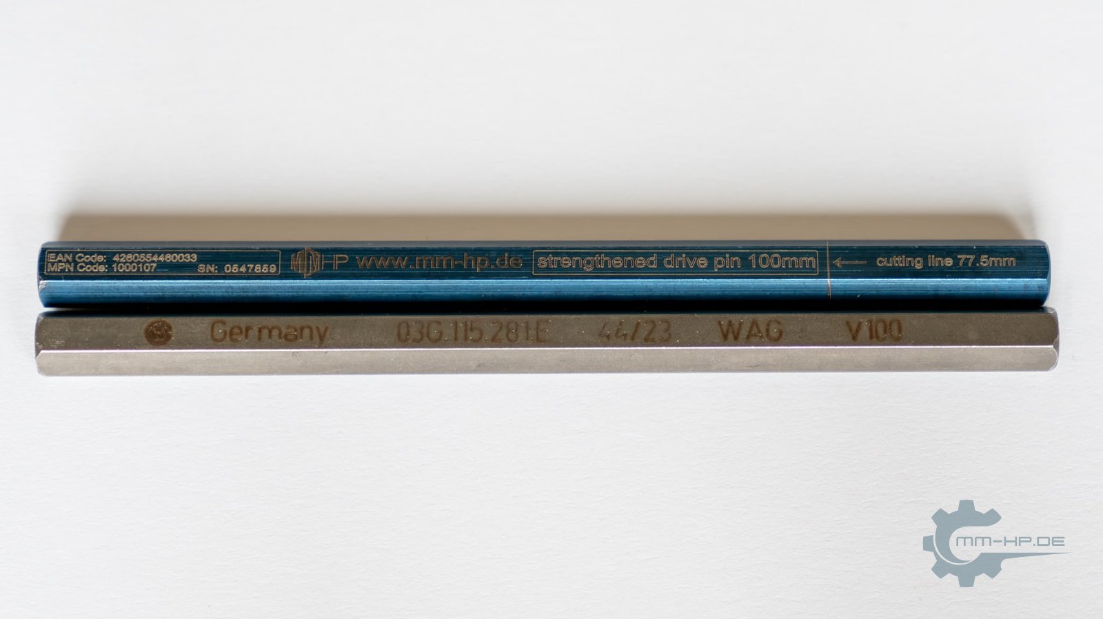 Two hexagonal drive pins side by side: a blue-coated reinforced pin above, the plain stock pin below