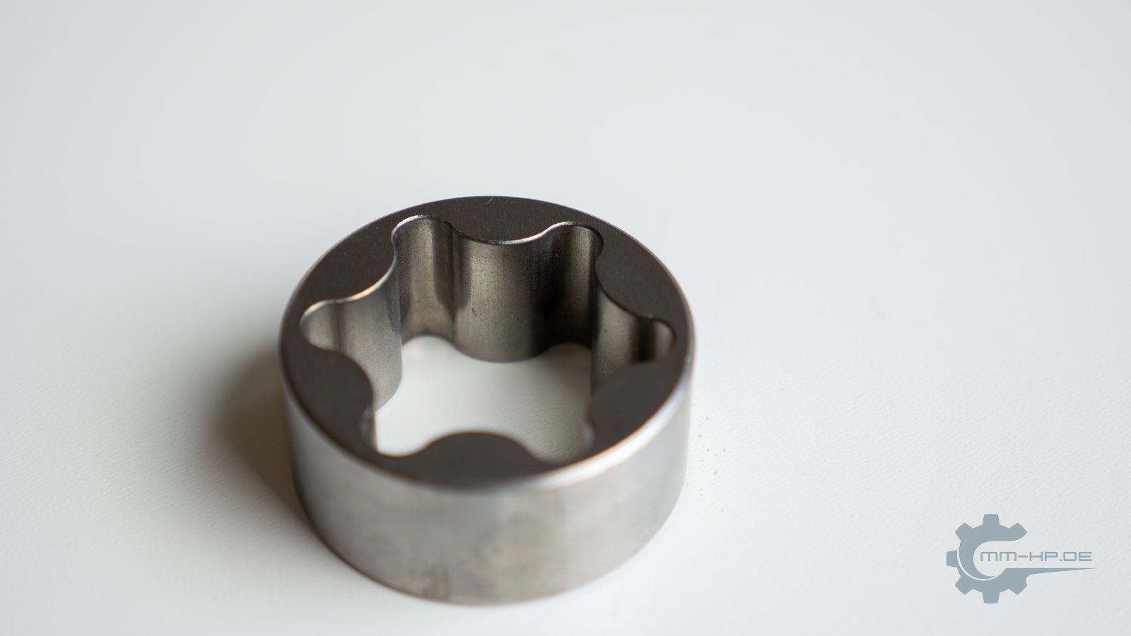 New outer rotor of an oil pump, seen at an angle from above, bright surface without running marks