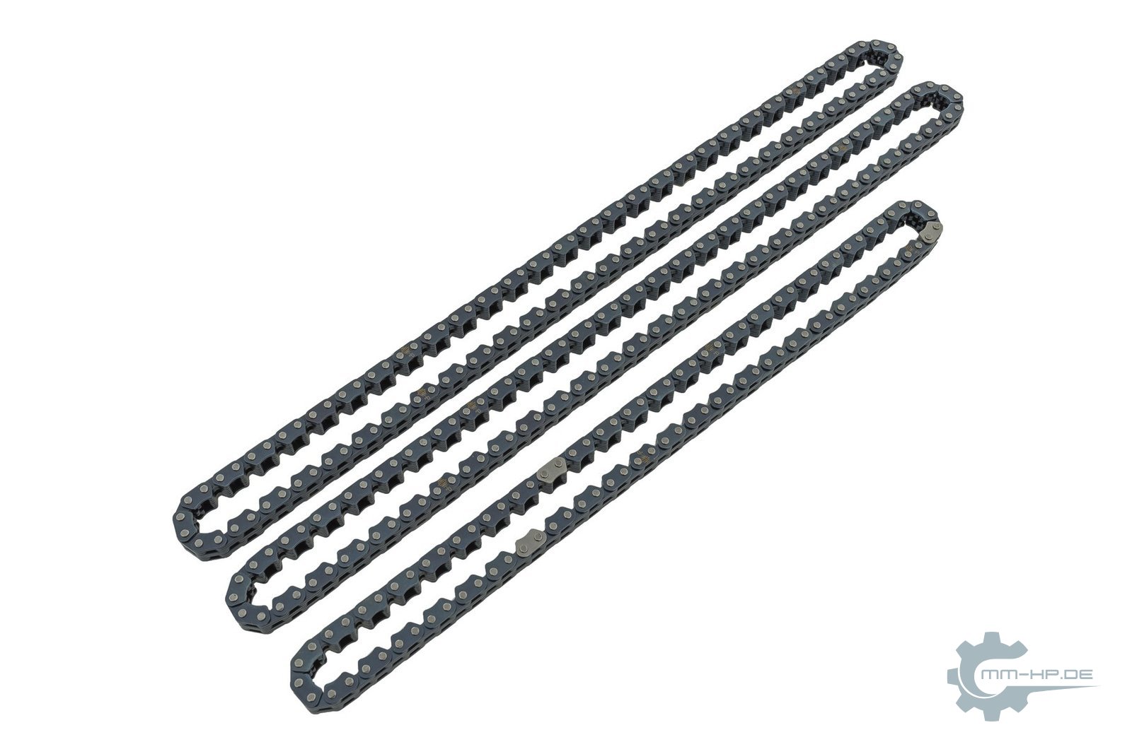 Three new timing chains laid diagonally side by side